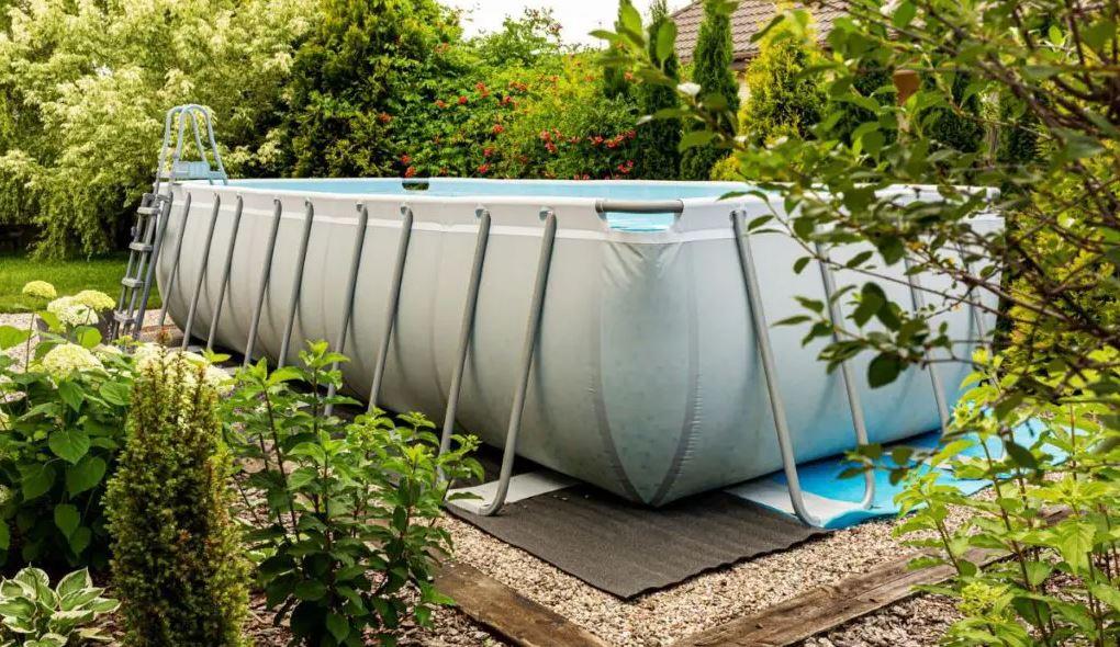 Above ground swimming pool in yard
